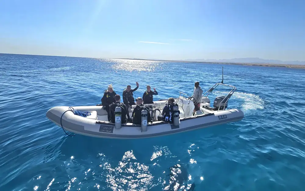 Aquarius divers on a dive boat over the Red Sea in Makadi Bay, Egypt