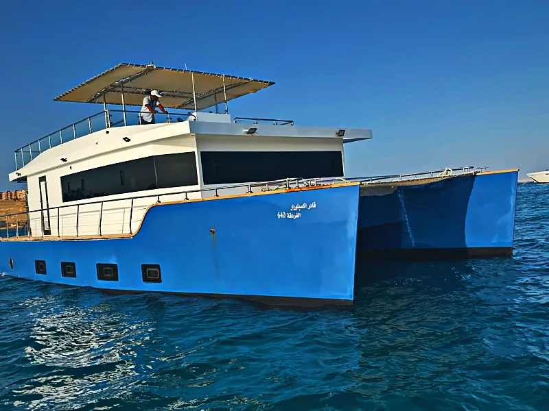 Qader Explorer catamaran seen from the side at sea