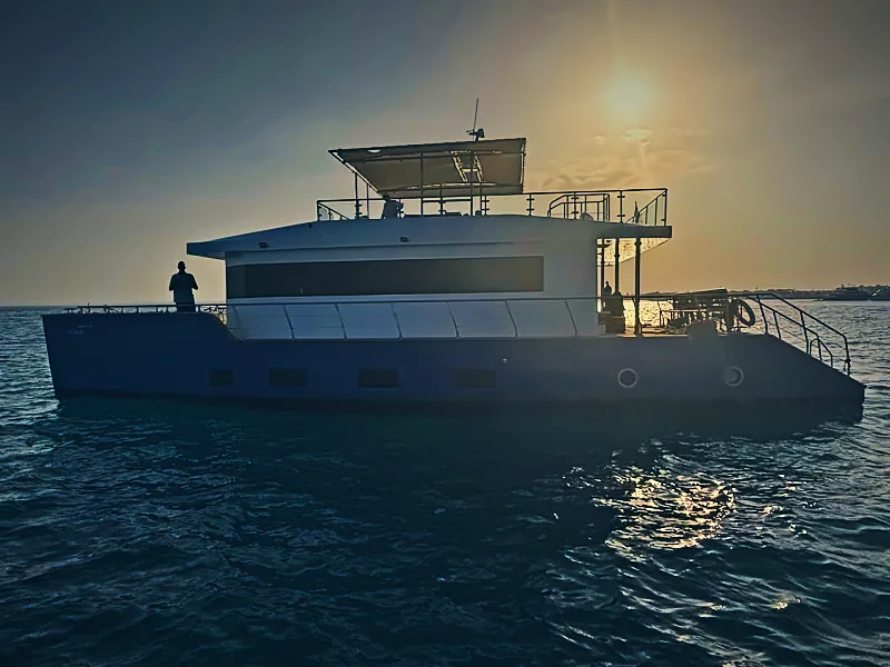 Qader Explorer catamaran at sunset off Hurghada