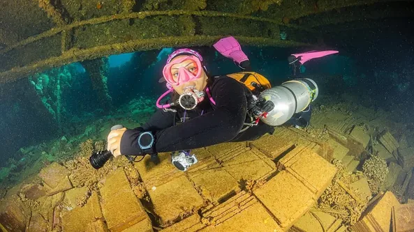 Technical wreck diver inside a Red Sea wreck near Hurghada