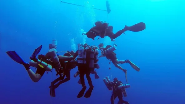 Team of technical divers on a decompression stop in the Red Sea, Hurghada