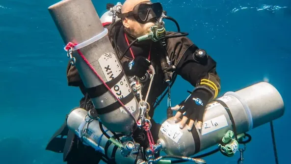 Technical diver carrying stage cylinders in the Red Sea, Hurghada