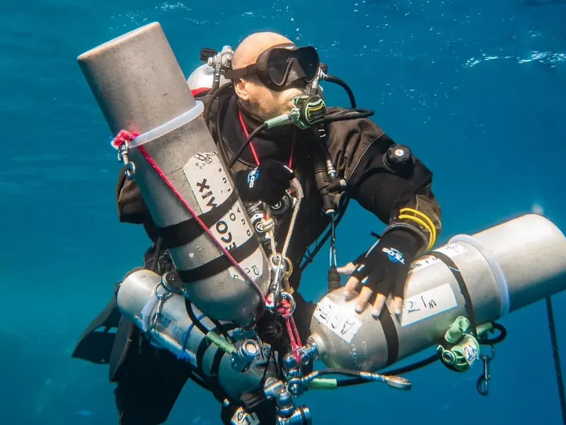 Technical diver carrying stage cylinders in the Red Sea, Hurghada